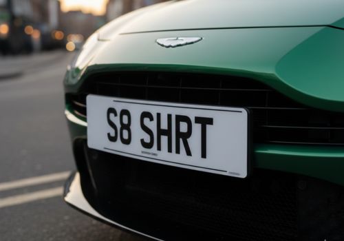 Short plate fitted on car - custom cut for fewer characters, road legal